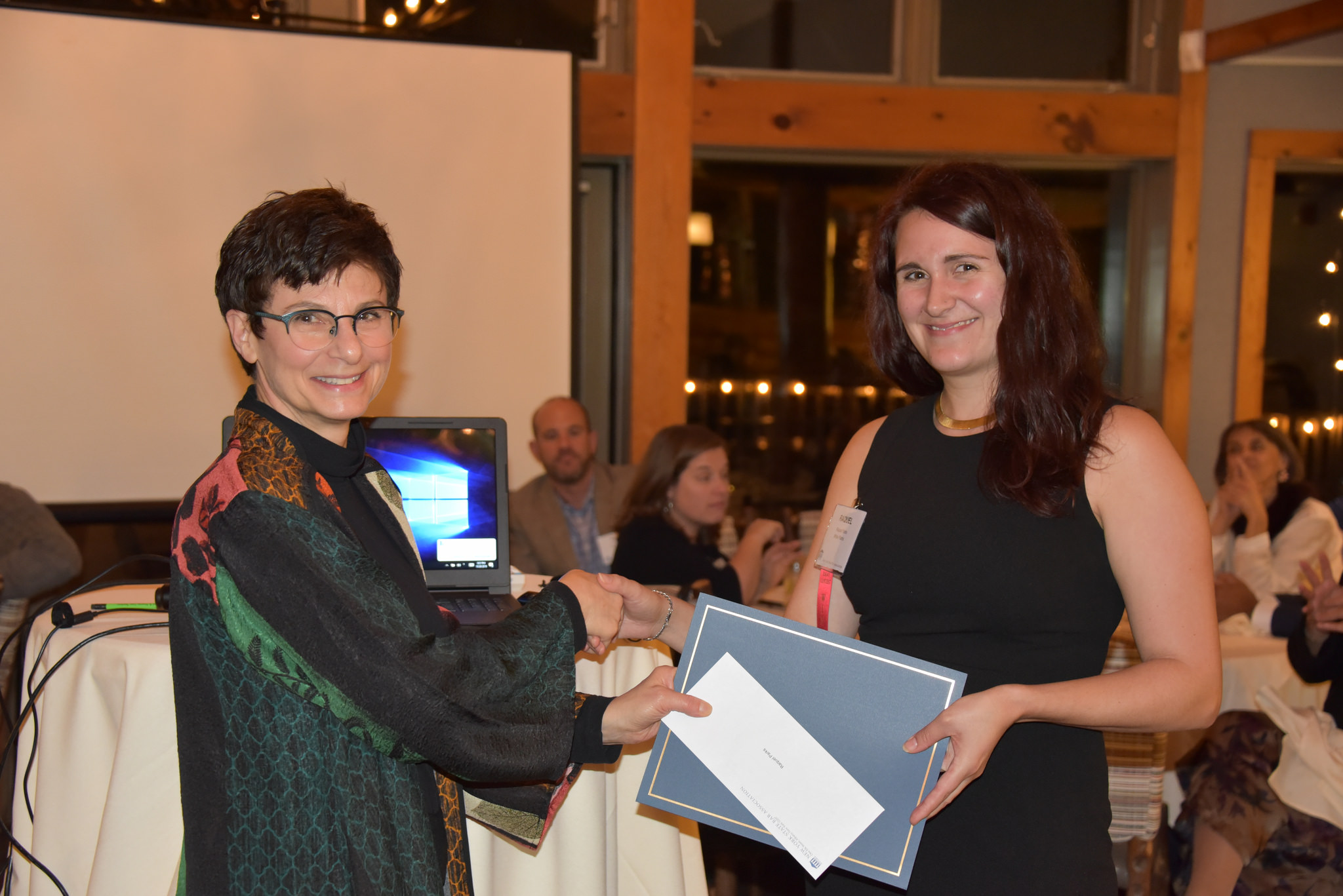 Miriam Villani presents an award.